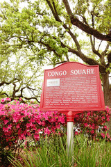 Sign in Armstrong Park commemorating site of Congo Square, a historic gathering place for enslaved Africans