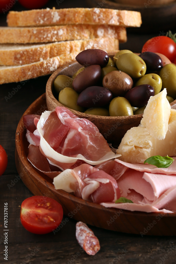 Poster antipasti tapas with cheese and ham on wooden table