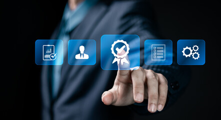 Quality assurance concept. Businessman touching Quality assurance icon on digital screen for ISO certification and standardization. certificate, approval, compliance to requirements.