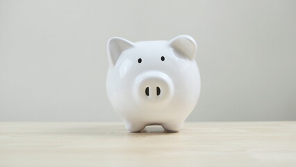 Finance, saving money, white piggy bank on seamless white background. - obrazy, fototapety, plakaty