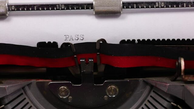 text PASSWORD with a vintage typewriter with black ink