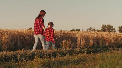 child girl daughter kid holding hand farmer mother, agriculture, business wheat field, friendly family, mother farmer holding her daughter hand wheat field, hands parent child, farmer with child - obrazy, fototapety, plakaty