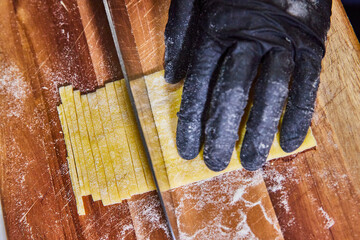 Handmade Pasta Cutting Close-Up in Kitchen