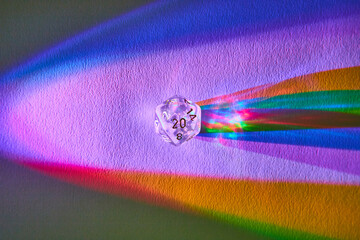 Colorful Dice Refraction on Textured Surface, Macro View