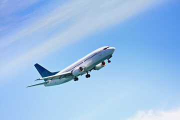 Airplane, flying and blue sky for travel, holiday and vacation or immigration opportunity with New...