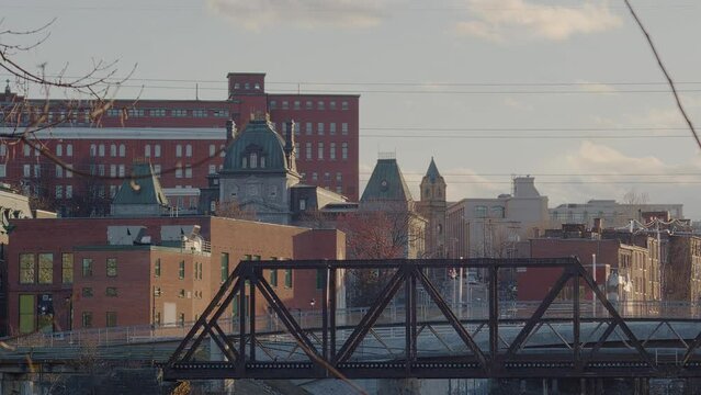 Eastern Townships small city Sherbrooke downtown with railroad bridge and buildings in Quebec Canada Estrie time lapse
 