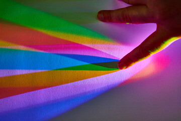 Hand Selecting Color from Rainbow Spectrum Display