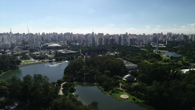 Aerial view of Ibirapuera Park - Parque Ibirapuera, Sao Paulo, Brazil. Landmark avenue and buildings of city. Ibirapuera lake. This image is perfect for projects related to events, travel and tourism.