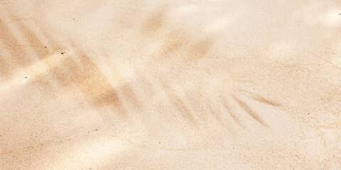 Beige Beach Sand with delicate textures and palm leaf shadow, fine sandy beach at sunlight, minimal nature banner, calm relahation concept, natural shore ocean or sea close up texture - obrazy, fototapety, plakaty