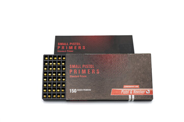 Detail of a box of small pistol type primers for reloading pistol ammunition. on white background