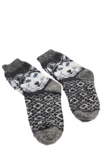 Detail of some thick wool gray socks with a drawing of a wolf on a white background.