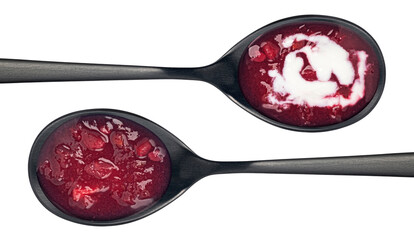Borscht in black spoon isolated on white background, top view