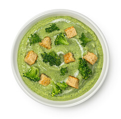 Broccoli cream soup with croutons isolated on white background, top view