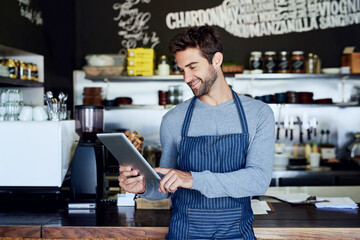 Small business, coffee shop and man with tablet checking online review, web or reservation in cafe....