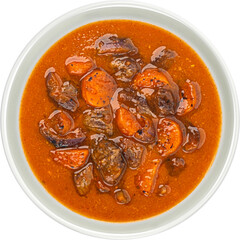 Beef stew with vegetables isolated on white background, top view