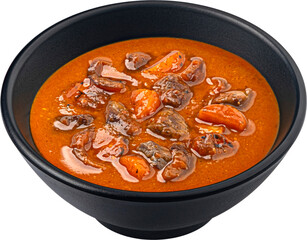 Beef stew in black bowl isolated