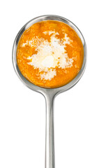 Spoon of Thai cream soup with coconut milk isolated on white background, top view