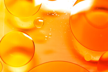 The oil on the surface of the water turned yellowish orange.