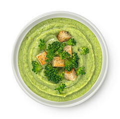 Broccoli cream soup with croutons isolated on white background, top view