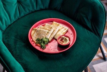 Hummus with olive oil, herbs, chickpeas and pita bread