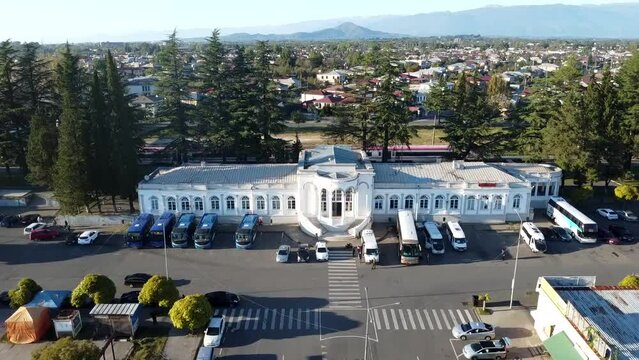 Drone view: Zugdidi Railway Station in Georgia, capturing its unique structure and scenic backdrop.