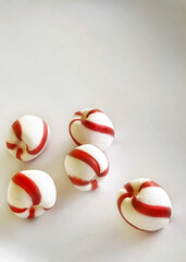 Soft, mint candy balls on a white background with copy space