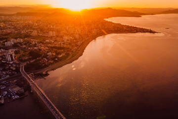 Cable bridge and downtown with sunset in Florianopolis, Brazil. Drone view - 787411656