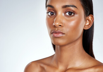 Skincare, beauty and studio portrait of Indian woman for dermatology in mockup space. Face, makeup...