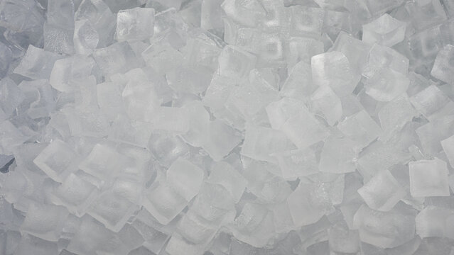 A pile of ice cubes is shown in a close up