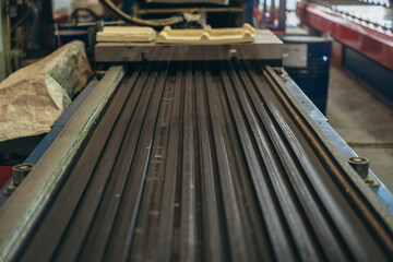 A long metal strip with a black color