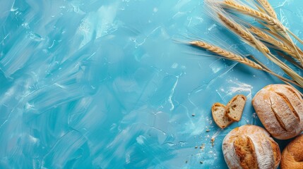 ears of wheat with fresh bread on a old blue background, Copy space for text, Flat lay bakery concept