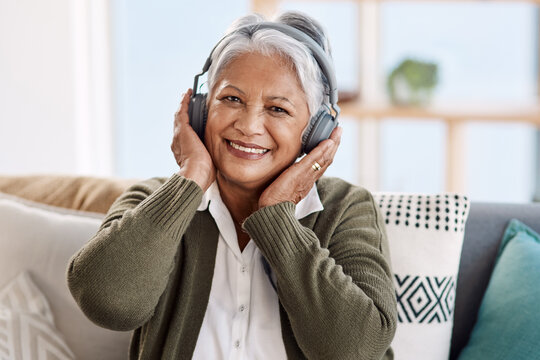Portrait, house and old woman with headphones, streaming music or retirement with audio or listening to radio. Face, senior person or relax with pensioner or headset with podcast, smile or sound