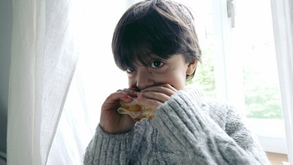 Happy Boy Enjoying Sandwich Close-Up, Small Child Eating Carb-Rich Snack in Afternoon, standing by...