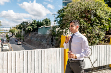 Business executive talking on the cell phone while walking to work.