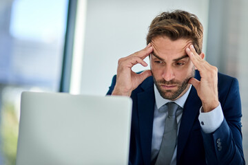Businessman, laptop and headache of anxiety in office with burnout, overwhelmed by workload and internet glitch. Professional, employee and frustrated with migraine and stress for deadline on mockup