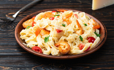 Italian pasta with shrimps , parmesan and tomatoes