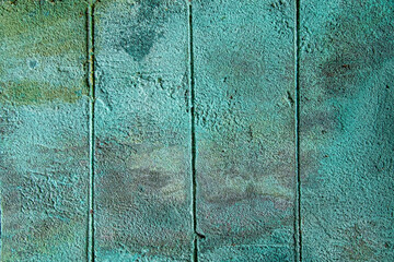 Turquoise painted concrete wall with mildew stains texture