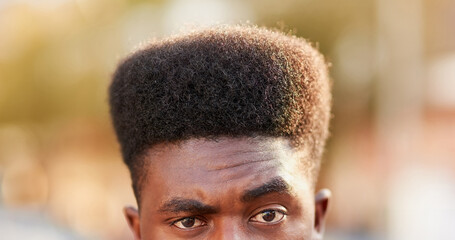 Black man, portrait and eyes for haircut in outdoors, afro and curly hairstyle in city. Male...