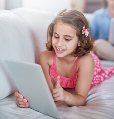 Girl, child and relax on sofa with tablet for games, movies or elearning platform with happiness and development. Internet, streaming and subscription with ebook on online education website at home