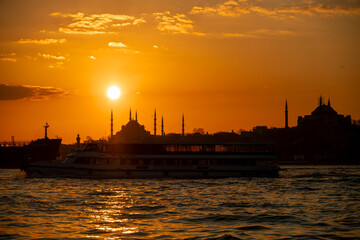 Fototapeta premium Silhouette of City of Istanbul, Sunset Time, View of Bosphorus, Showing of Blue Mosque and Hagia Sofia