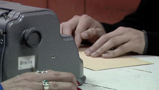 Young Man Reading Braille at School. Close up.