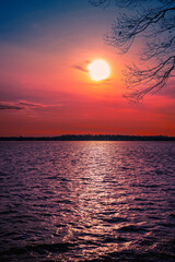 Saturated Stormy Moonrise Landscape over the Lake Monona at Olin Park in Madison, Wisconsin, USA