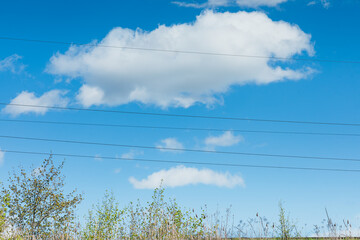 blue sky with high tension lines - 787447097