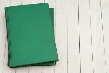 Retro old green book on a desk - 787447231