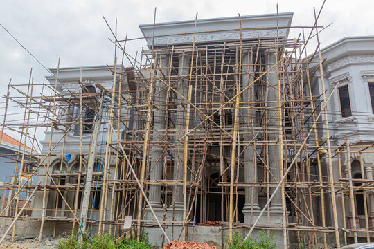Construction site with bamboo scaffolding in Luang Namtha town, Laos