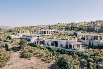 Hotel complex with colonnades on a hill. Amanzoe, Peloponnese, Greece. Drone