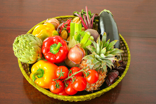 Basket full of fresh vegetables and fruits..