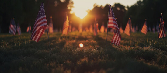 A field covered with American flags to honor fallen soldiers, with the rising sun gently lighting the scene and creating a visual tribute. Memorial Day, Independence Day , with copy - obrazy, fototapety, plakaty