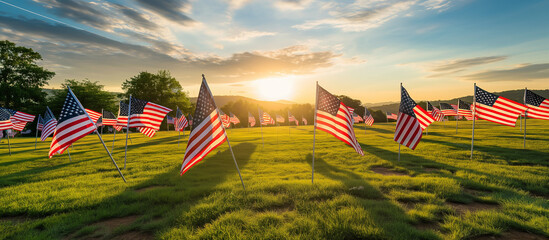 A field covered with American flags to honor fallen soldiers, with the rising sun gently lighting the scene and creating a visual tribute. Memorial Day, Independence Day , with copy - obrazy, fototapety, plakaty