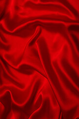 Red silk or satin luxury fabric texture can use as abstract background.